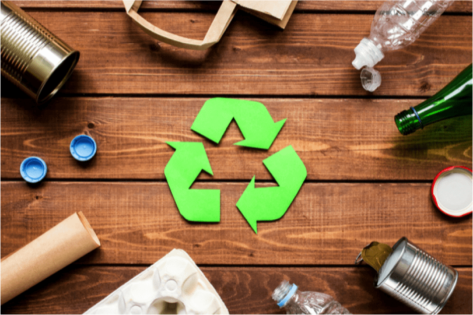 a green recycling symbol surrounded by recyclable materials