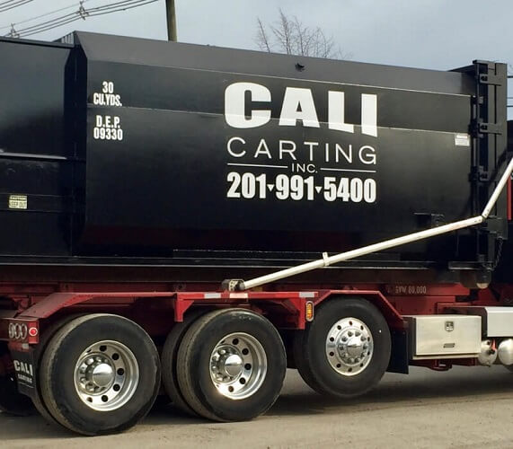 black cali carting truck compressed