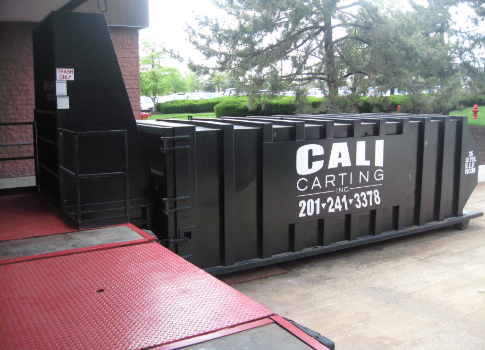 Compactor outside of business location