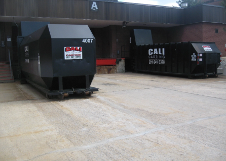 Compactors outside of building