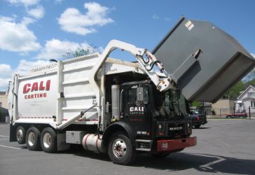 Trash being loaded onto truck