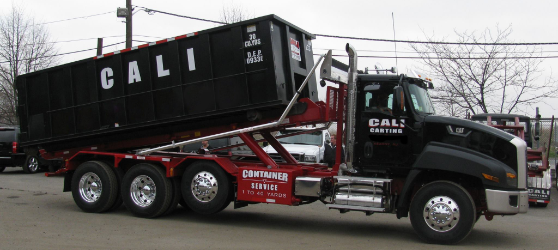 Truck holding 10-yard dumpster