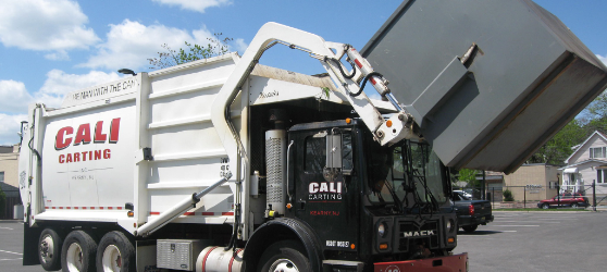 Garbage being loaded onto truck