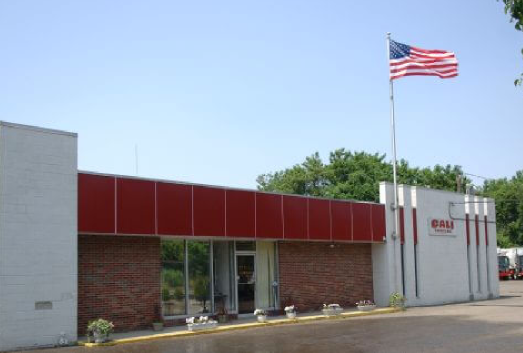 Cali Carting building with American flag outside